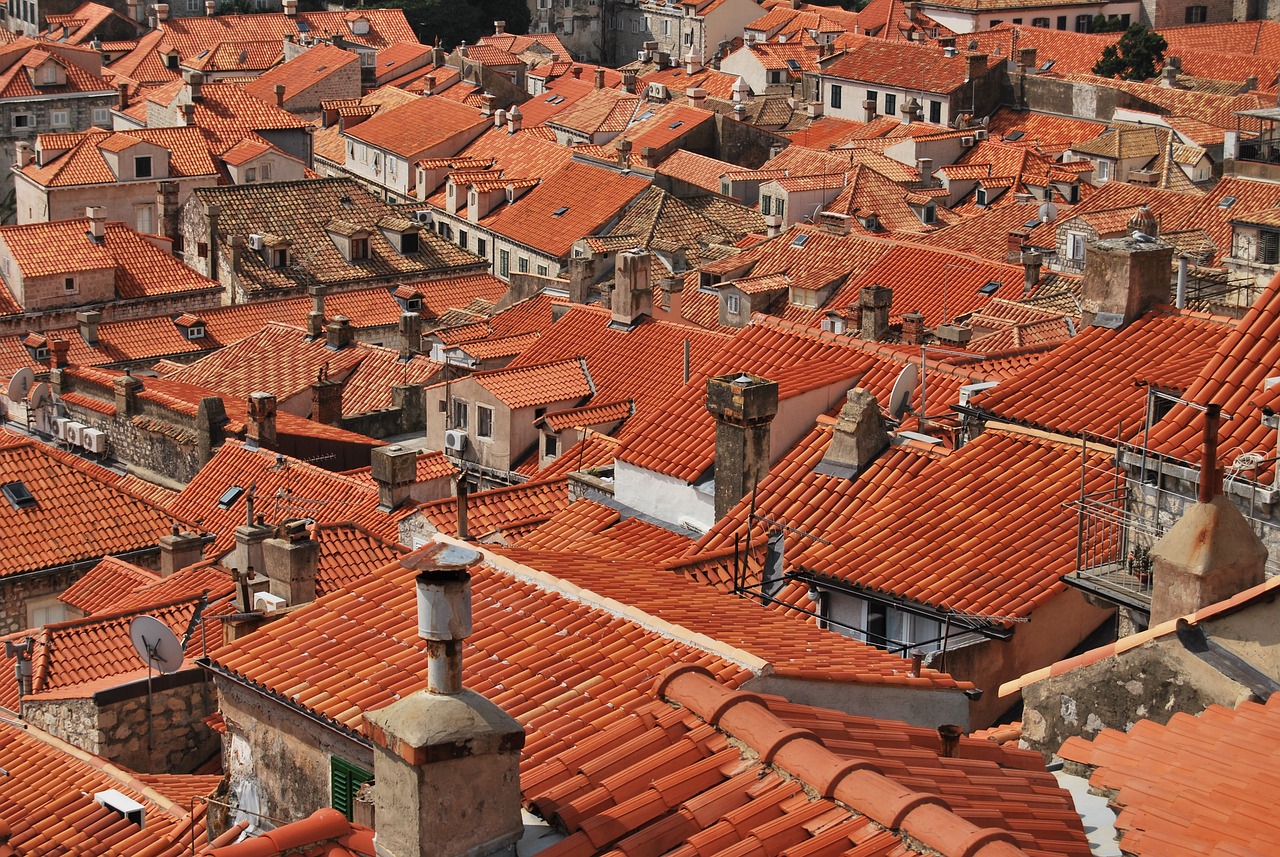 The building complex is covered with a dense and orderly orange red tile roof.