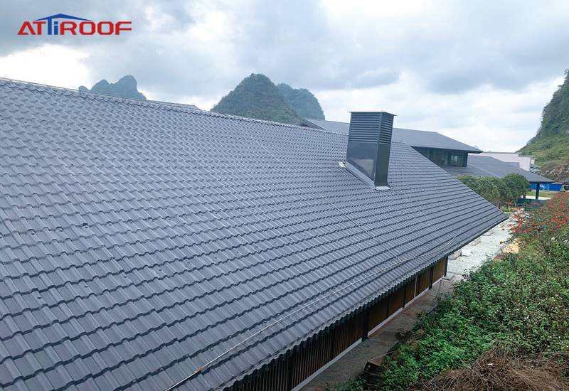 A bungalow roof made of resin shingles.